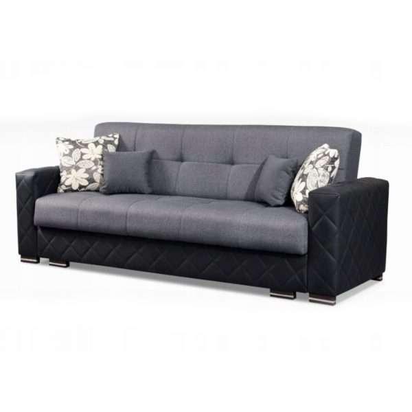 Gray sofa with black accents and floral-patterned cushions 